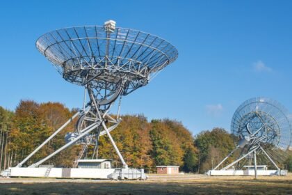 A photo of two big radio antennas.